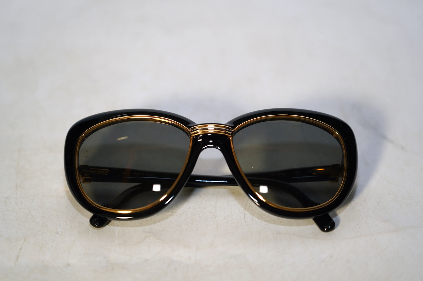 Two pairs of Must de Cartier sunglasses